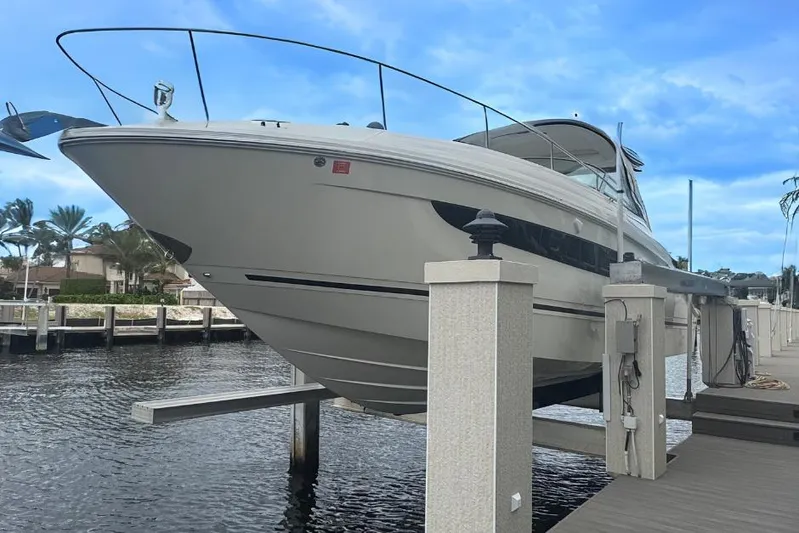  Yacht Photos Pics 2016 Sea Ray 350 Sundancer yacht docked, elevated above water, with clear blue sky.