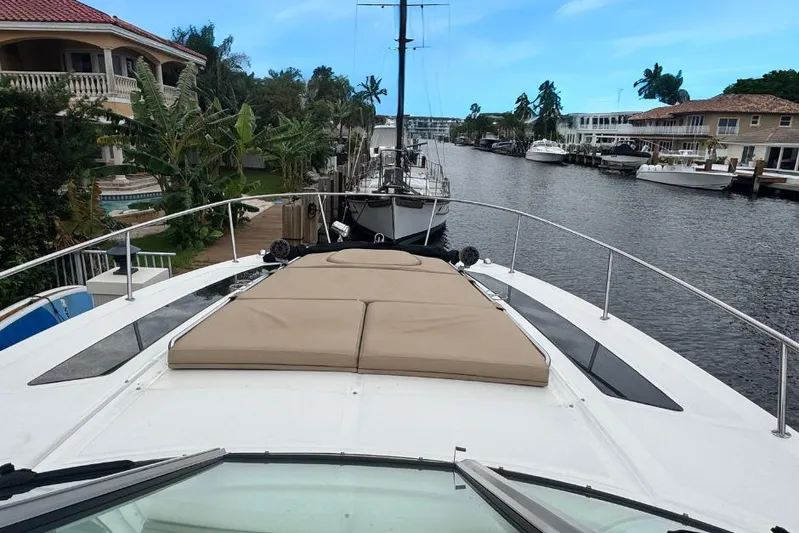  Yacht Photos Pics 2016 Sea Ray 350 Sundancer yacht docked in a scenic canal setting.