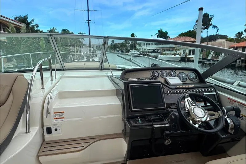  Yacht Photos Pics 2016 Sea Ray 350 Sundancer helm with modern controls and waterfront view.