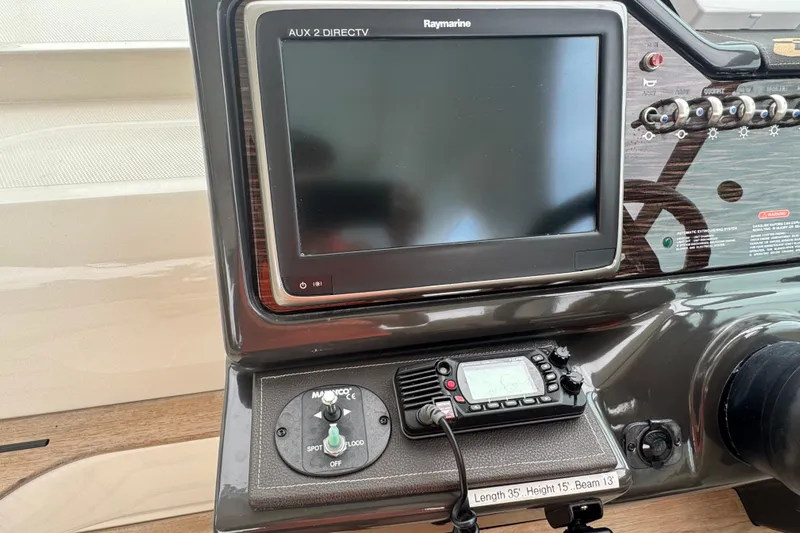  Yacht Photos Pics Control panel of a 2016 Sea Ray 350 Sundancer with Raymarine display and controls.