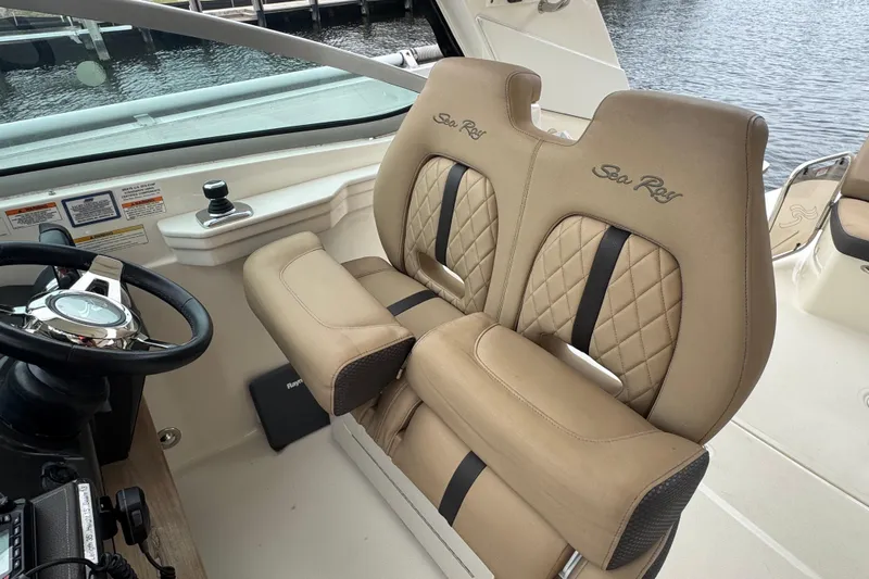  Yacht Photos Pics Luxurious helm seating on 2016 Sea Ray 350 Sundancer boat, featuring elegant design and comfort.