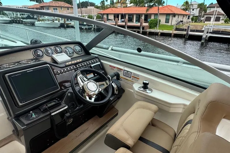  Yacht Photos Pics Helm of 2016 Sea Ray 350 Sundancer with modern controls and waterfront view.