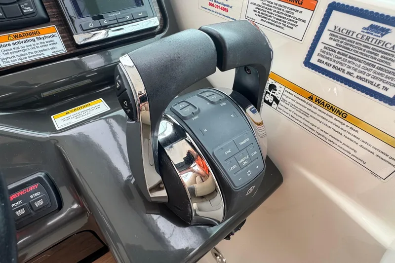  Yacht Photos Pics Control panel of a 2016 Sea Ray 350 Sundancer boat with warning labels.
