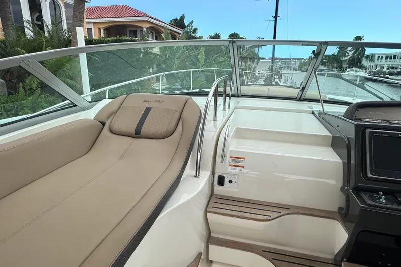  Yacht Photos Pics 2016 Sea Ray 350 Sundancer cockpit with beige seating and modern dashboard.