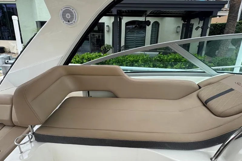  Yacht Photos Pics 2016 Sea Ray 350 Sundancer interior with beige seating and speaker.