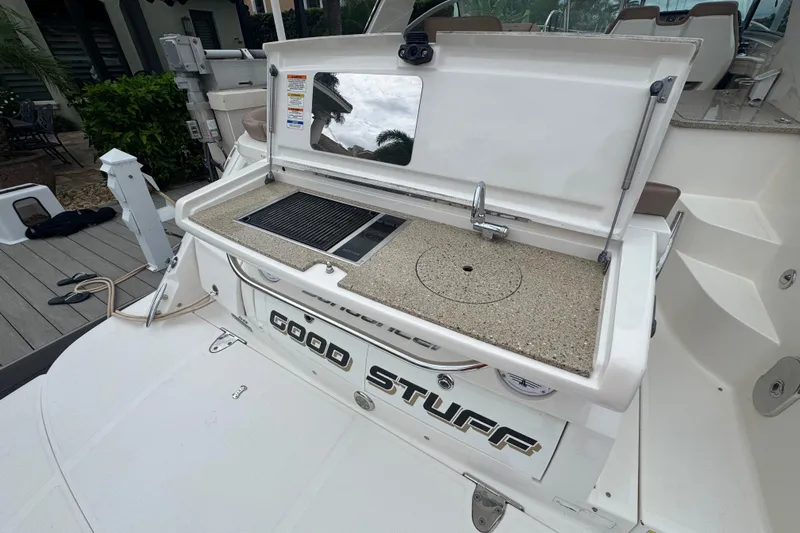  Yacht Photos Pics 2016 Sea Ray 350 Sundancer boat with outdoor kitchenette and "Good Stuff" label.