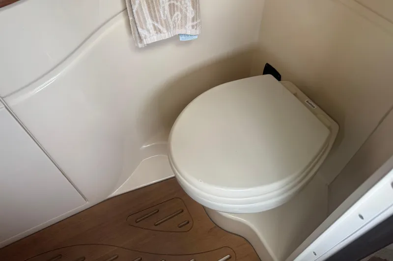  Yacht Photos Pics 2016 Sea Ray 350 Sundancer bathroom with toilet and wooden floor.