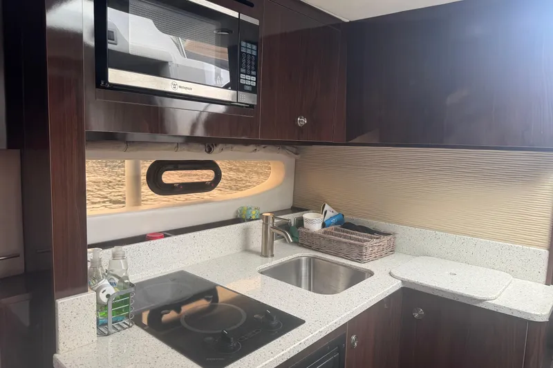  Yacht Photos Pics Luxurious 2016 Sea Ray 350 Sundancer yacht kitchen with modern amenities and sleek design.