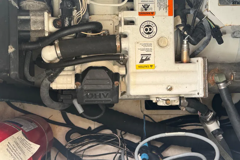  Yacht Photos Pics Engine compartment of a 2016 Sea Ray 350 Sundancer boat, showing mechanical components.