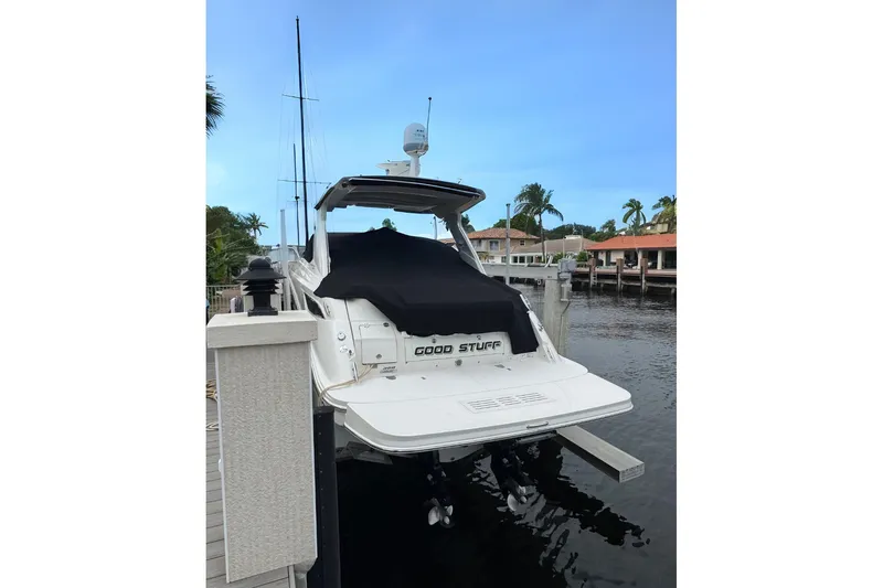  Yacht Photos Pics 2016 Sea Ray 350 Sundancer docked, rear view with covered deck, calm waters.