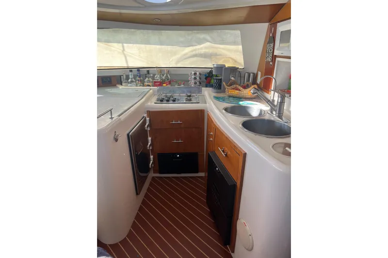 Sea Glass Yacht Photos Pics Interior of 2000 Fountaine Pajot Belize 43 yacht kitchen with stove and sink.