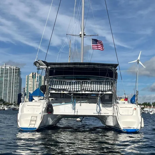Sea Glass Yacht Photos Pics Fountaine Pajot Belize 43 catamaran, 2000 model, docked with US flag.