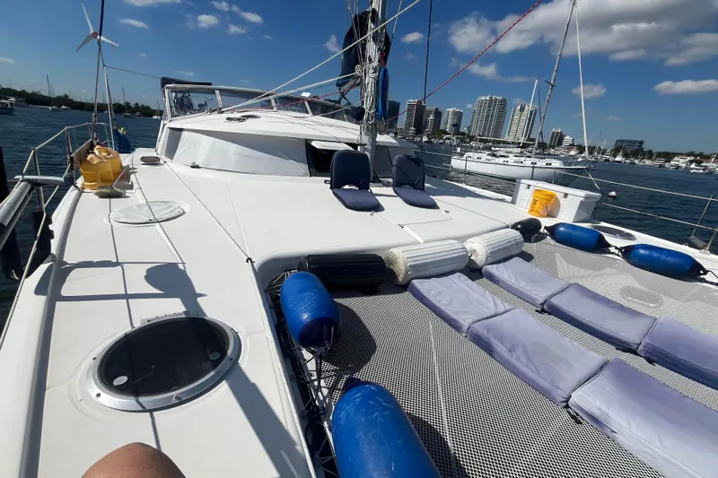 Sea Glass Yacht Photos Pics Fountaine Pajot Belize 43 catamaran deck with city skyline in background, 2000 model.