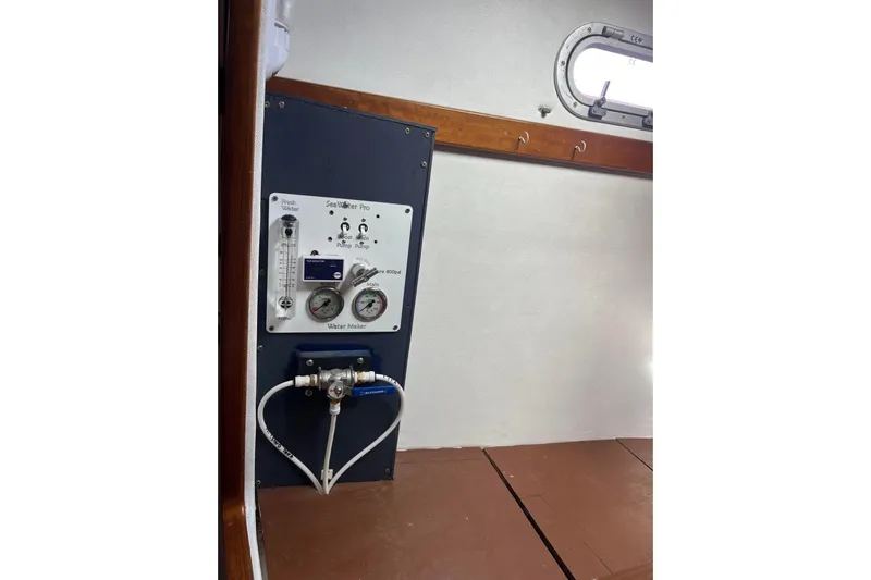 Sea Glass Yacht Photos Pics Water maker system inside 2000 Fountaine Pajot Belize 43 catamaran, featuring control panel and gauges.