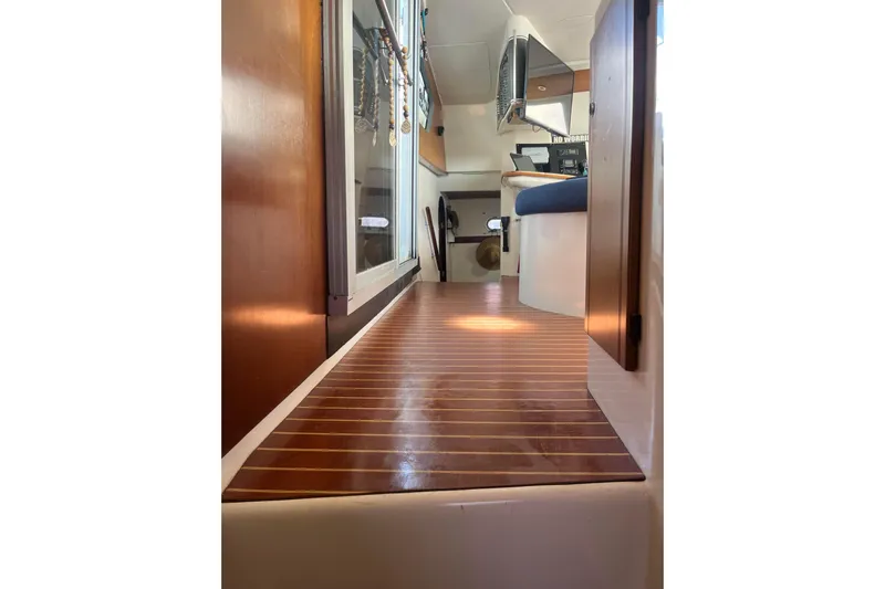 Sea Glass Yacht Photos Pics Interior view of 2000 Fountaine Pajot Belize 43 catamaran with wooden flooring and modern design.