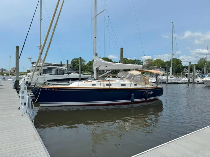 Side Aye Yacht Photos Pics Sailboat docked at marina, Tartan 3400 model, 2009, under clear blue sky.