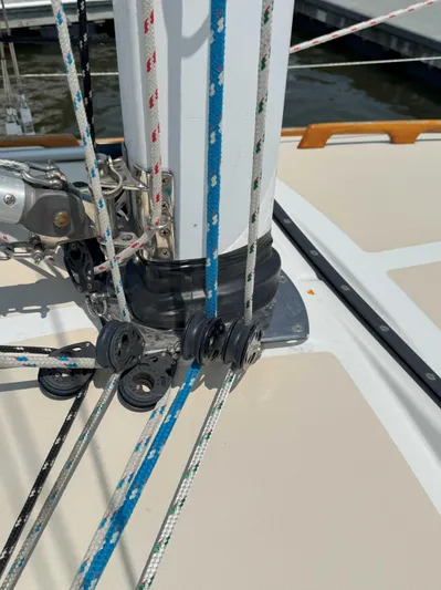 Side Aye Yacht Photos Pics Sailboat rigging on a 2009 Tartan 3400, featuring ropes and pulleys near the mast base.