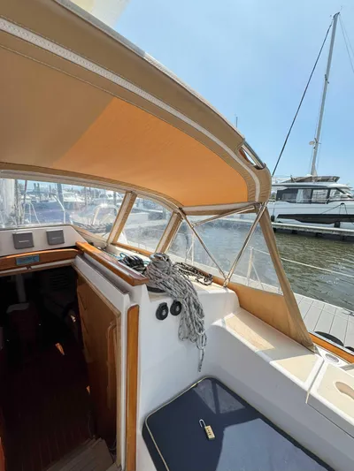 Side Aye Yacht Photos Pics 2009 Tartan 3400 sailboat interior with tan canopy, docked at marina.