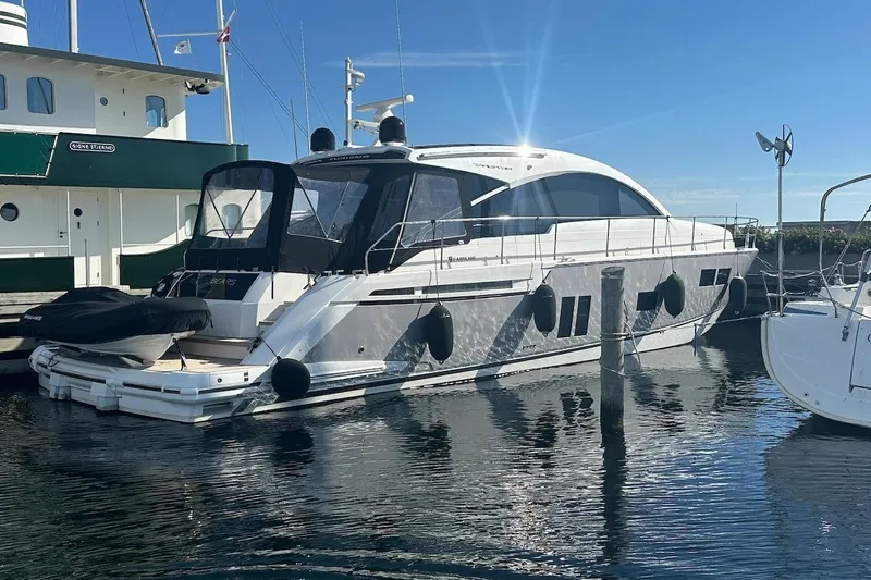 Three Bears Yacht Photos Pics Luxury 2012 Fairline Targa 58 yacht docked in a sunny marina.