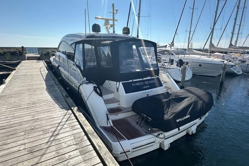 Three Bears Yacht Photos Pics 2012 Fairline Targa 58 yacht docked at marina, rear view with covered equipment.