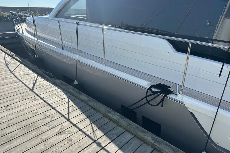 Three Bears Yacht Photos Pics 2012 Fairline Targa 58 yacht docked at a wooden pier.