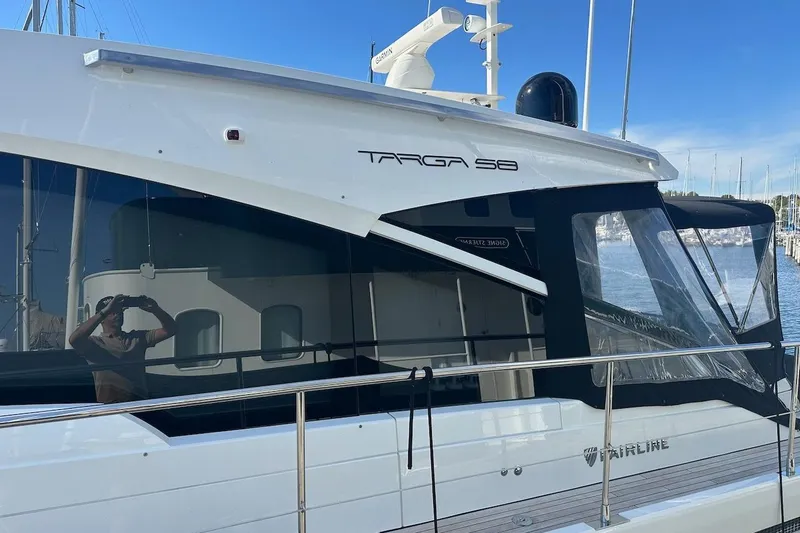 Three Bears Yacht Photos Pics 2012 Fairline Targa 58 yacht docked, featuring sleek design and modern windows.
