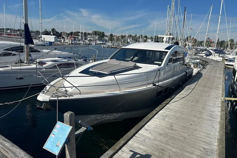 Three Bears Yacht Photos Pics 2012 Fairline Targa 58 yacht docked at a marina under clear blue skies.