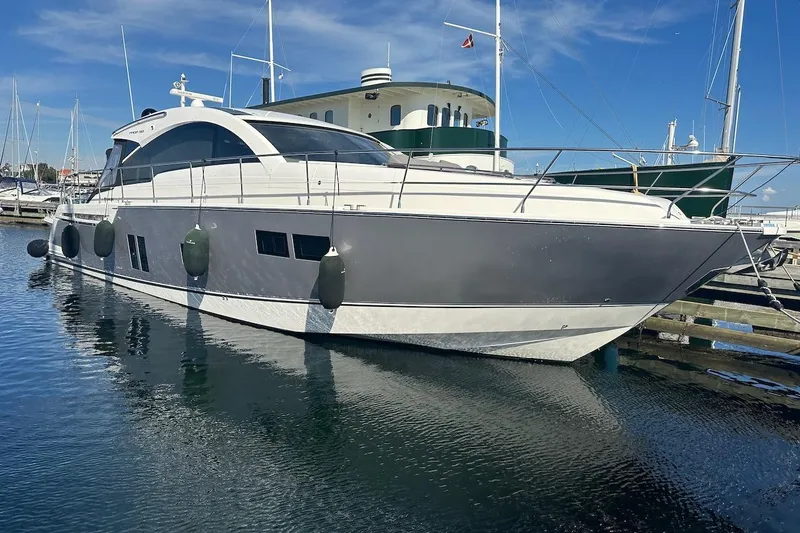 Three Bears Yacht Photos Pics 2012 Fairline Targa 58 yacht docked in a marina under clear blue skies.