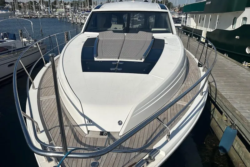 Three Bears Yacht Photos Pics 2012 Fairline Targa 58 yacht docked at marina, showcasing sleek design and spacious deck.