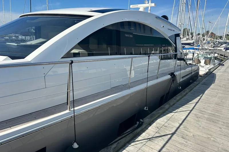 Three Bears Yacht Photos Pics Luxury 2012 Fairline Targa 58 yacht docked at marina under clear blue sky.