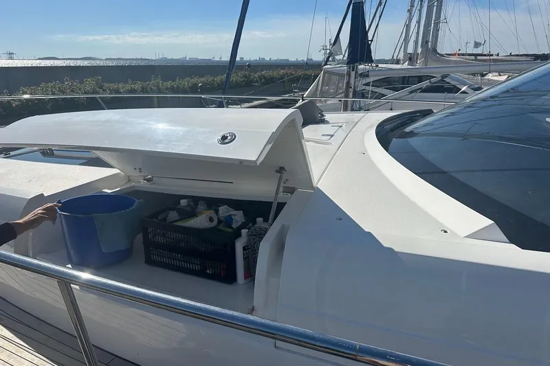 Three Bears Yacht Photos Pics 2012 Fairline Targa 58 yacht deck with open storage compartment.