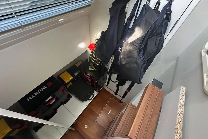 Three Bears Yacht Photos Pics Storage area in a 2012 Fairline Targa 58 yacht with life jackets and equipment.