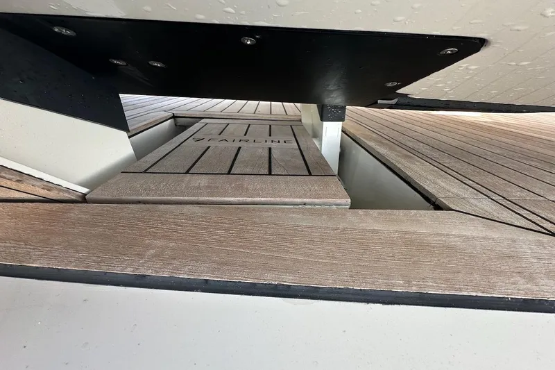 Three Bears Yacht Photos Pics Fairline Targa 58 yacht deck detail, showcasing sleek wooden design, 2012 model.