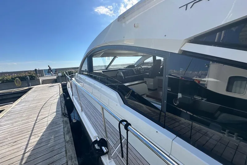 Three Bears Yacht Photos Pics Luxury 2012 Fairline Targa 58 yacht docked under clear blue sky.