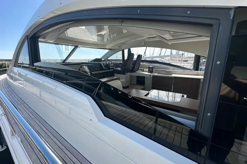 Three Bears Yacht Photos Pics 2012 Fairline Targa 58 yacht interior view through window, showcasing sleek design and modern amenities.