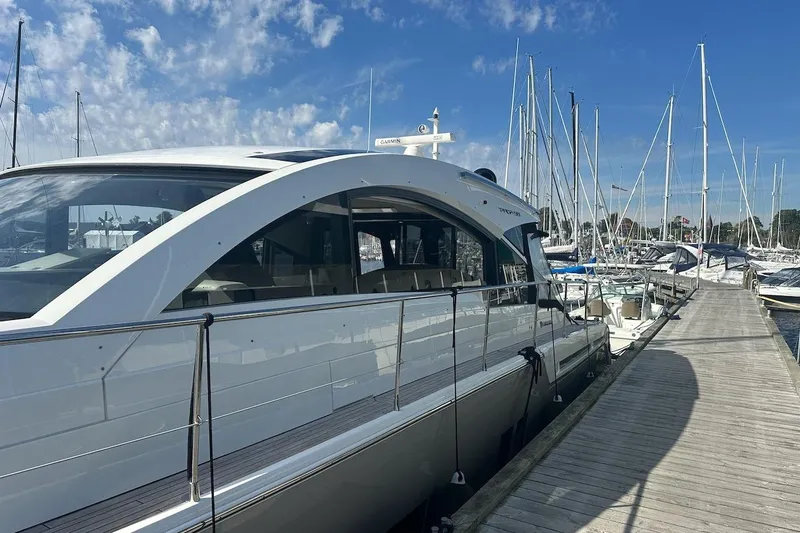 Three Bears Yacht Photos Pics 2012 Fairline Targa 58 yacht docked at marina under blue sky.