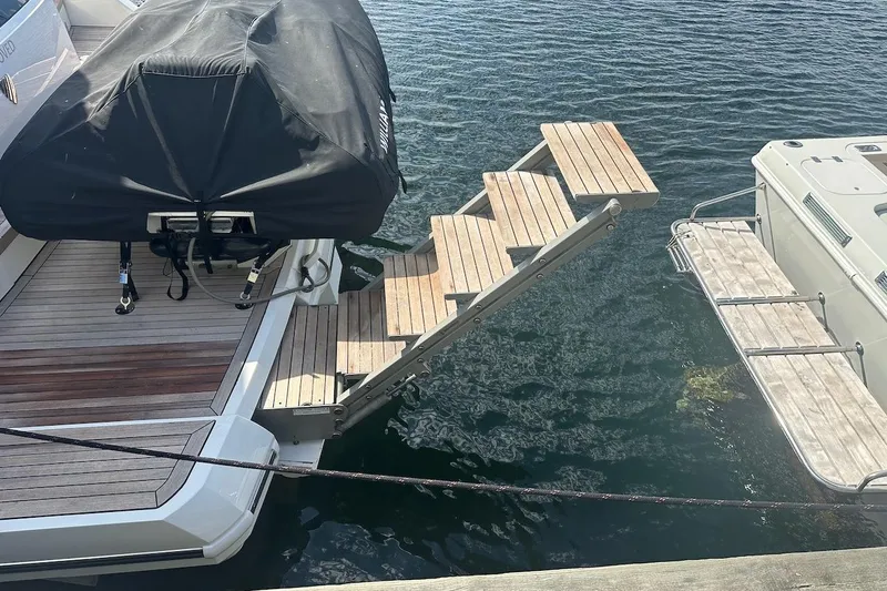 Three Bears Yacht Photos Pics Fairline Targa 58 yacht with extended wooden boarding steps, 2012 model.