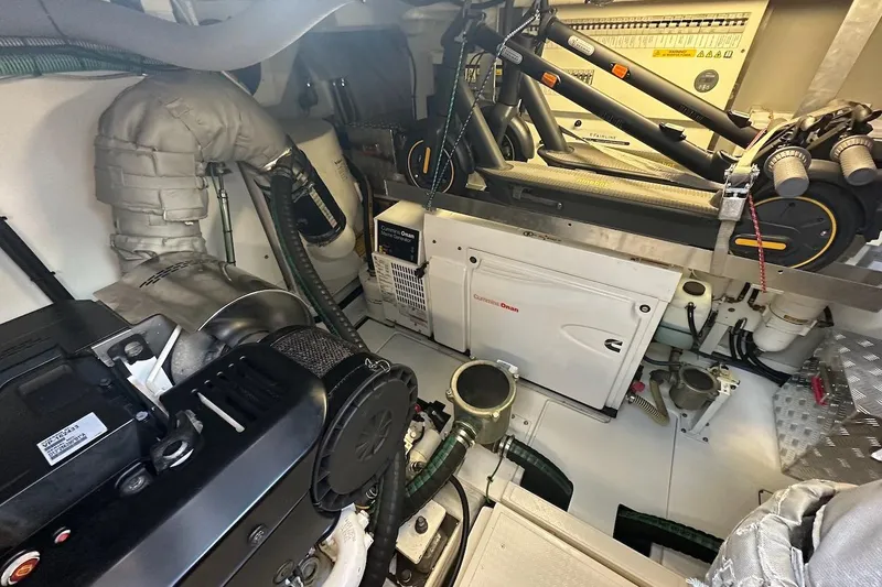 Three Bears Yacht Photos Pics Engine room of 2012 Fairline Targa 58 yacht with Cummins Onan generator and equipment.