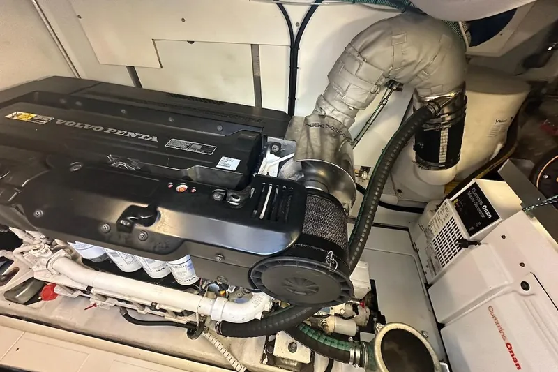 Three Bears Yacht Photos Pics Engine room of 2012 Fairline Targa 58 with Volvo Penta engine and Cummins Onan generator.