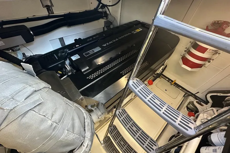 Three Bears Yacht Photos Pics Engine room of 2012 Fairline Targa 58 yacht with Volvo Penta engine and ladder.