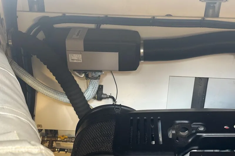 Three Bears Yacht Photos Pics Engine compartment of a 2012 Fairline Targa 58 yacht, showcasing mechanical components.