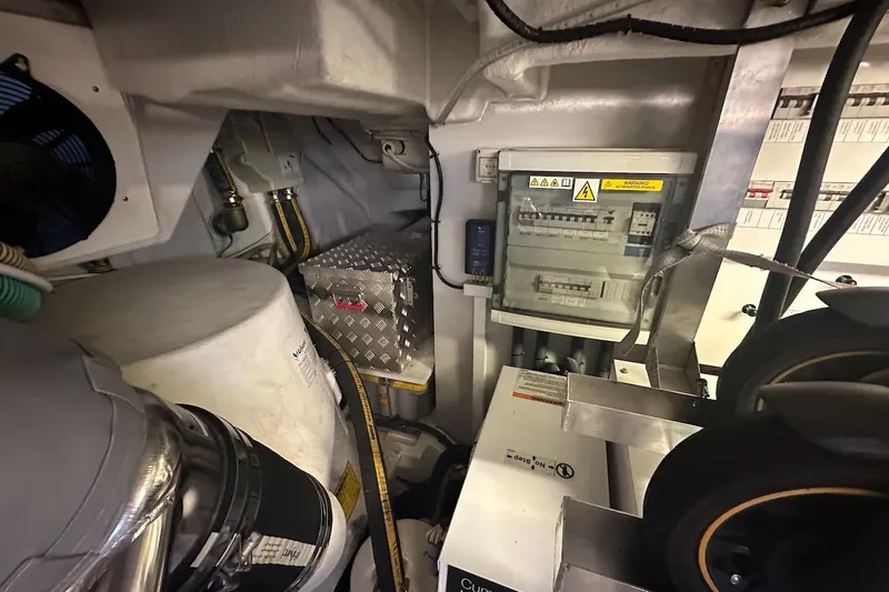 Three Bears Yacht Photos Pics Engine room of 2012 Fairline Targa 58 yacht with electrical panel and machinery.