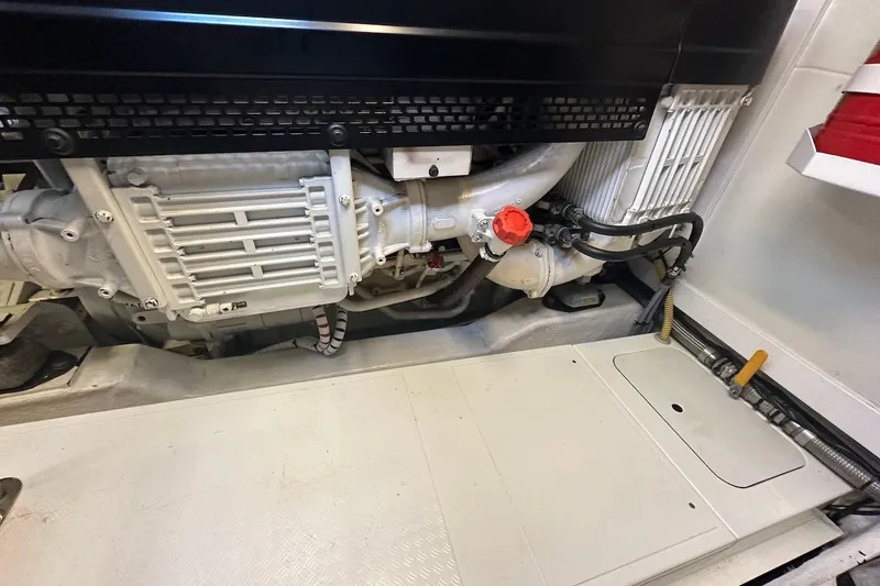 Three Bears Yacht Photos Pics Engine room of a 2012 Fairline Targa 58 yacht, showcasing mechanical components.