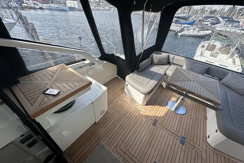 Three Bears Yacht Photos Pics Luxurious 2012 Fairline Targa 58 yacht interior with elegant seating and wooden flooring.