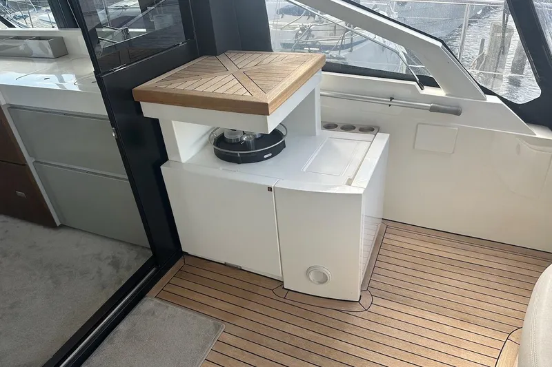 Three Bears Yacht Photos Pics Interior of 2012 Fairline Targa 58 yacht with wooden flooring and modern amenities.