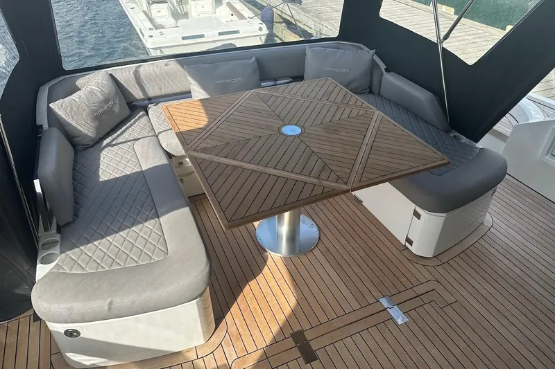 Three Bears Yacht Photos Pics Luxurious 2012 Fairline Targa 58 yacht interior with elegant seating and wooden table.