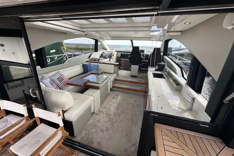 Three Bears Yacht Photos Pics Luxurious interior of 2012 Fairline Targa 58 yacht with modern seating and helm.