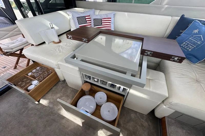Three Bears Yacht Photos Pics Luxurious interior of 2012 Fairline Targa 58 yacht with elegant seating and storage.