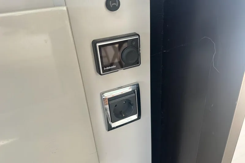 Three Bears Yacht Photos Pics Control panel and power outlet on 2012 Fairline Targa 58 yacht interior.