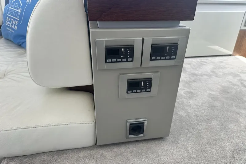 Three Bears Yacht Photos Pics Control panel on 2012 Fairline Targa 58 yacht, featuring digital displays and switches.